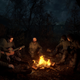 A bunch of survivors sit around a campfire in Stalker 2.